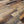 Close-up of a wooden floor with various shades of brown and gray.