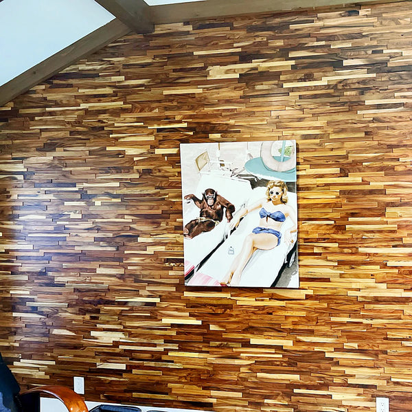 Wooden wall paneling with a colorful painting of a woman and monkey on a chair.