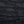 Dark stone wall with horizontal slabs