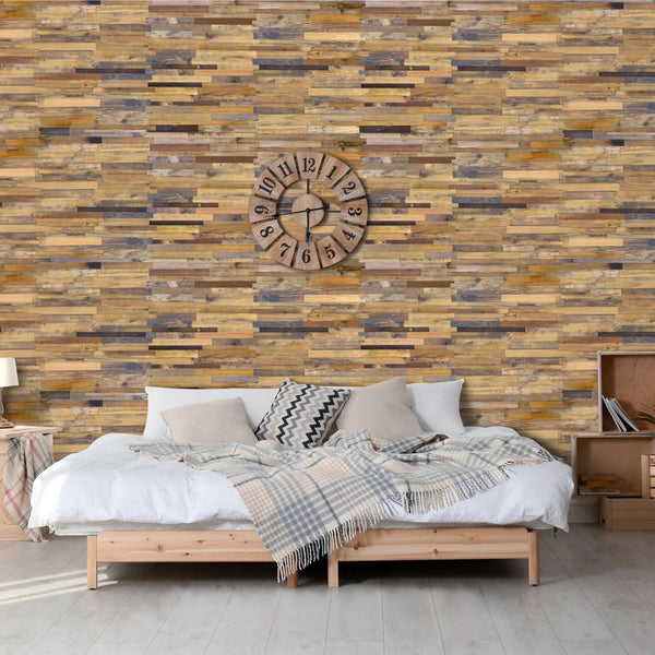 Bedroom with wooden wall paneling and a clock, featuring a bed with pillows and blankets.