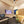 Modern home entertainment room with TV, treadmill, and sauna.