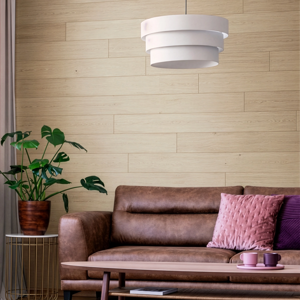 Living room with brown sofa, pink pillow, and white pendant light.