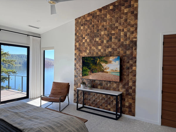 Modern bedroom with wooden wall paneling, TV, and view of water.