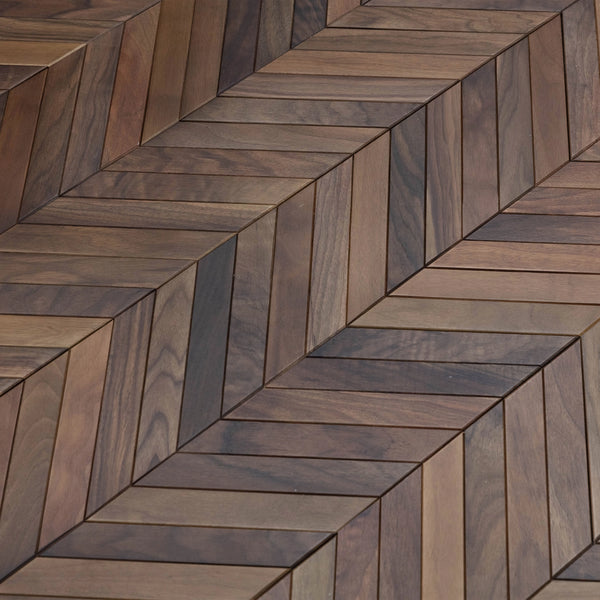 Wooden tiles arranged in a herringbone pattern