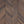 Wooden panel with chevron pattern in brown tones