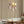 Decorative wall sconces with a striped wall and sofa in the foreground