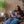 Woman reading a magazine titled 'Forbes Life' in a modern interior setting.