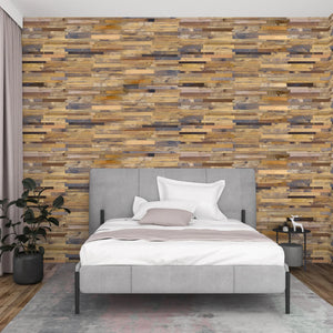 Bedroom with a wooden wall paneling and a bed with gray headboard and white bedding.