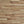 Wooden panel with horizontal slats of varying widths and colors.