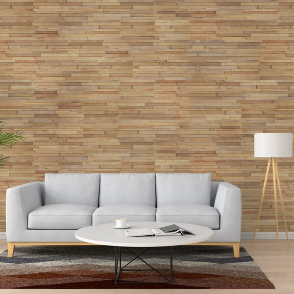 Gray sofa in a living room with a wooden wall and coffee table.