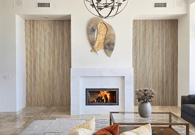 Living room with a fireplace, decorative wall art, and a coffee table.